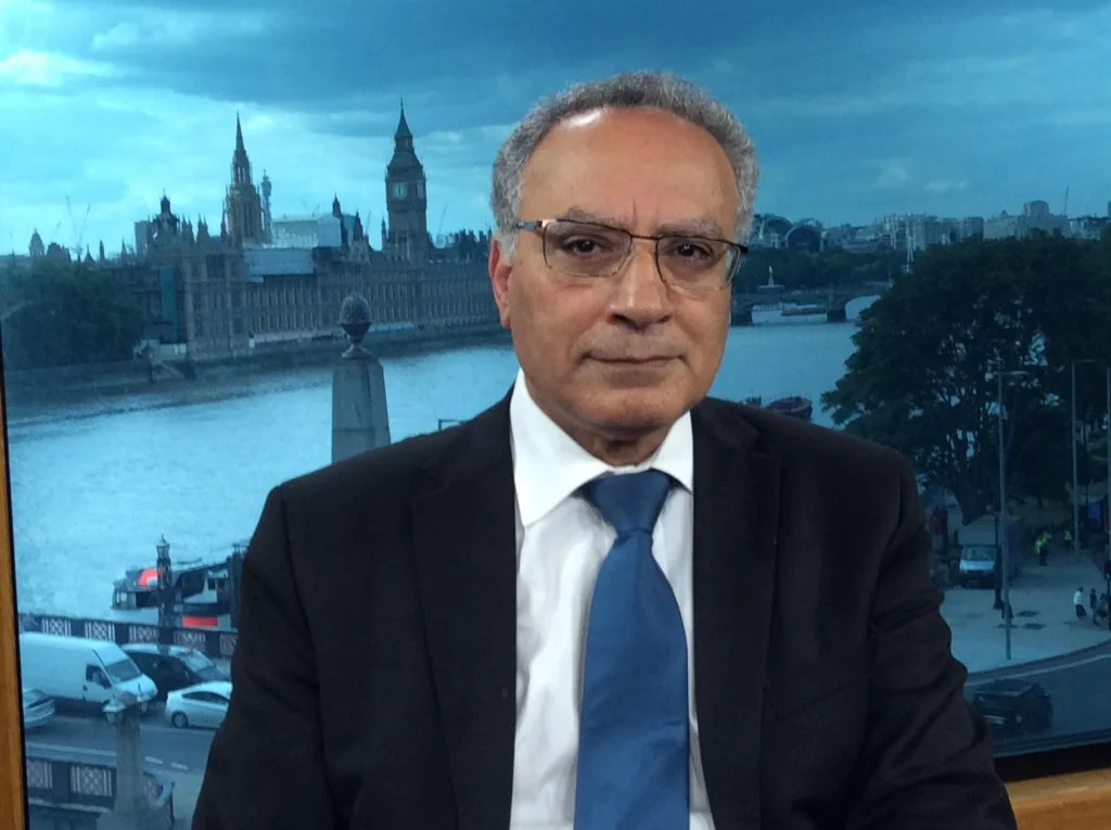Dr Wafik Moustafa with the Houses of Parliament behind him